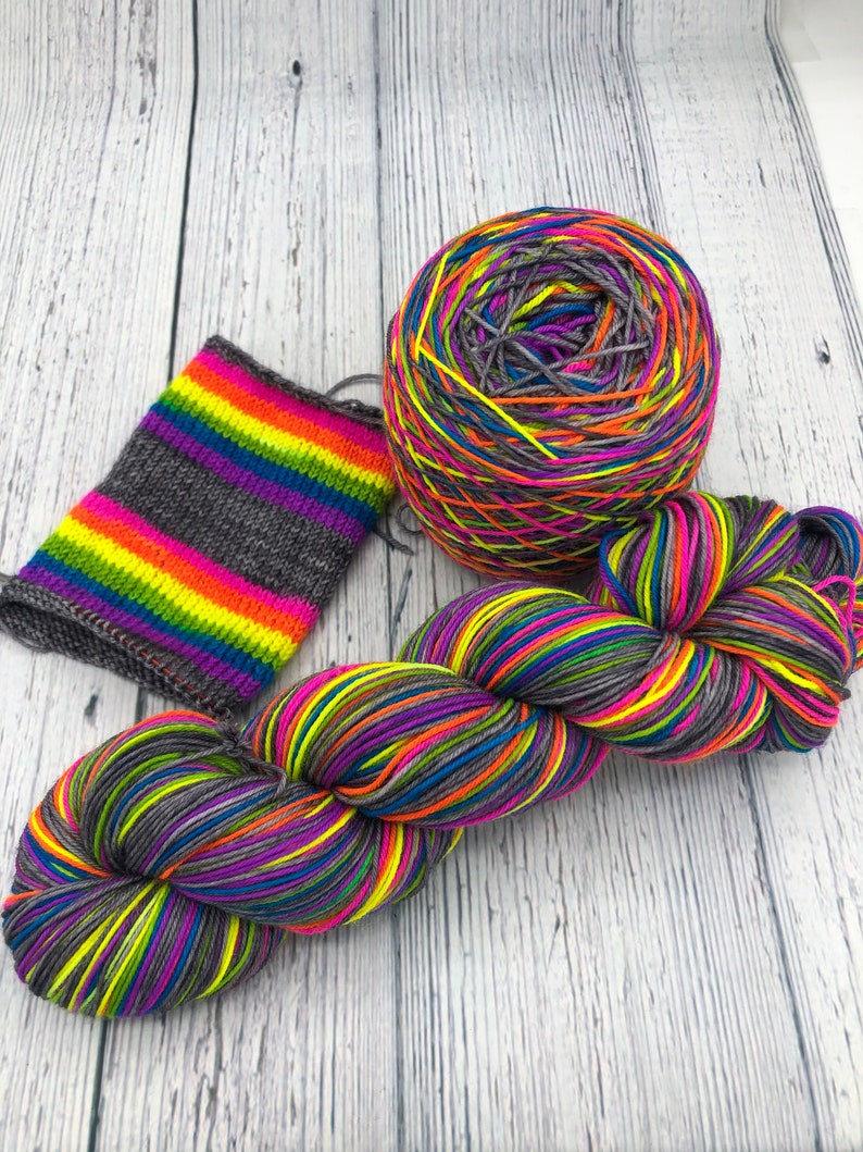 Hand dyed self striping grey, fluorescent rainbow sock yarn image 2