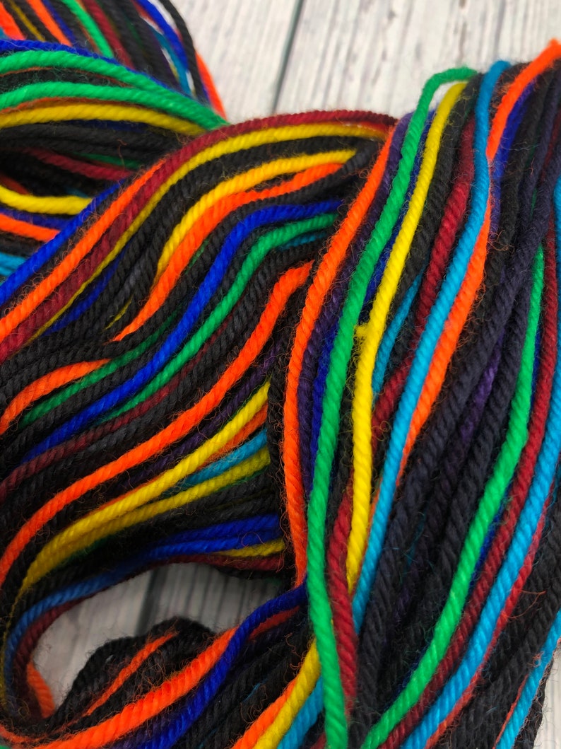 Hand dyed self striping black rainbow DK yarn Etsy