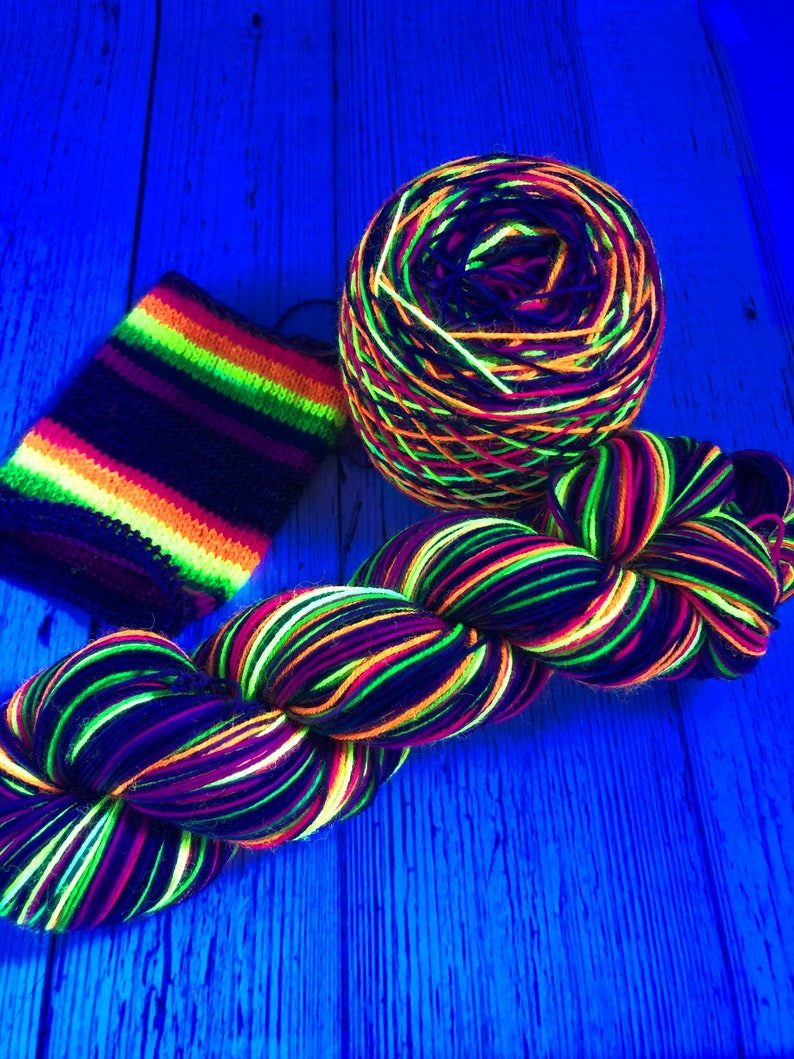 Hand dyed self striping grey, fluorescent rainbow sock yarn image 1