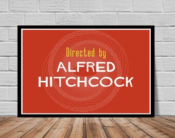 May include: A red poster with a white circle design and the text "Directed by ALFRED HITCHCOCK" in yellow and white.
