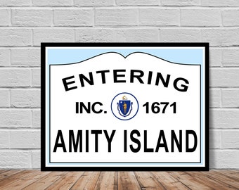 May include: Framed sign with the words "ENTERING AMITY ISLAND" in bold black letters. The sign includes the text "INC. 1671" and a circular emblem. The background is white with a light blue top border.