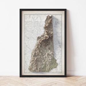 May include: Framed vintage map of New Hampshire with a 3D topographic relief. The map is in a black frame and features detailed geographical information. The relief adds depth and highlights the state's mountainous regions. The map is printed on aged paper.