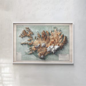 May include: A framed topographic map of Iceland featuring a three-dimensional relief effect. The map displays brown mountainous terrain, white glaciers, and light green coastal areas. It includes a legend and text labeled ISLAND in the corner.