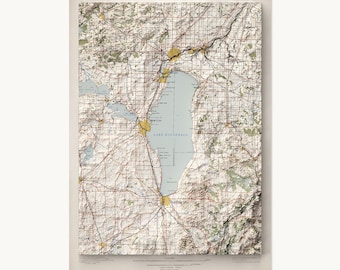 May include: A vintage topographic map of Lake Winnebago, Wisconsin, featuring detailed terrain shading, a grid overlay, and yellow-highlighted urban areas. The map includes text labels for geographic features and cities like Oshkosh and Fond du Lac.