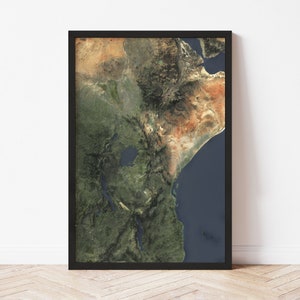 May include: A framed map of East Africa with a detailed satellite image of the region. The map shows the terrain, including mountains, rivers, and lakes. The colors are vibrant and realistic, giving the viewer a sense of the region's beauty and diversity.