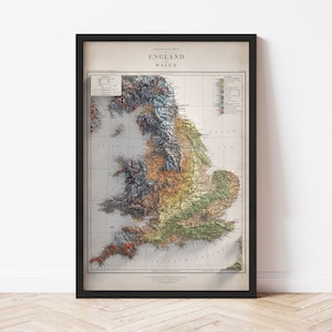 May include: An antique-style map of England and Wales, showing the topography of the region. The map is printed in shades of brown, green, and blue, with a key to the different colors and elevations. The map is framed in a black frame.