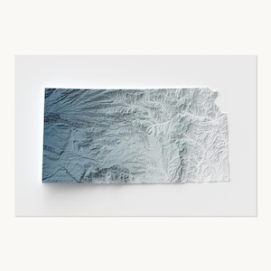 May include: A three-dimensional topographic map of the state of Kansas. The relief map features a gradient color scheme that transitions from a deep blue on the western side to a bright white on the eastern side, highlighting terrain details.