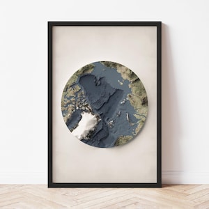 May include: A framed print of a circular map of the Arctic Ocean with a 3D effect. The map is in shades of blue, green, and white, with a white ice cap at the center.
