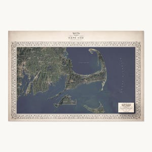 May include: A rectangular relief map of Cape Cod featuring a detailed satellite view of the coastline, landmasses, and surrounding Atlantic Ocean. The map is enclosed in an ornate, decorative border and includes the text "RELIEF MAP OF THE CAPE COD" and a small rectangular label in the bottom right corner with the text "ATLAS OF THE WORLD".