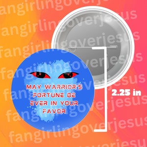 May include: A blue and white button with red eyes and the text "May Warrior's Fortune Be Ever In Your Favor". The button is 2.25 inches in diameter.