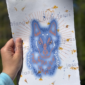 May include: A blue wolf illustration with orange accents on a white background with yellow flower petals scattered around it. The wolf's eyes are closed and it has a peaceful expression. The background has a sunburst effect with orange lines radiating from the centre.