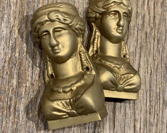 A superb pair of well cast classical antique gilt bronze decorations for furniture or decor.
