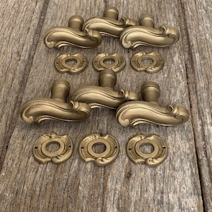 3 pairs of elegant gilt bronze door knobs and matching collars