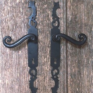 May include: A rustic wooden sign with the text "Welcome to our home" in white lettering. The sign features a distressed finish and a simple, inviting design, perfect for entryway decor.