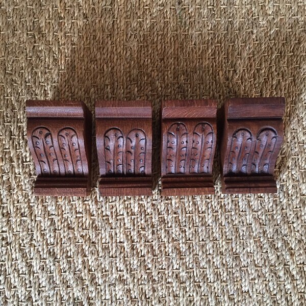 A  set of 4 French antique carved wooden supports with naturalist acanthus leaf decorative details