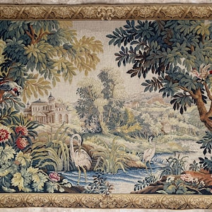 May include: A tapestry depicting a serene landscape with a river, trees, and a building in the background. The artwork features birds, flowers, and a decorative border. The color palette includes greens, blues, and beige.