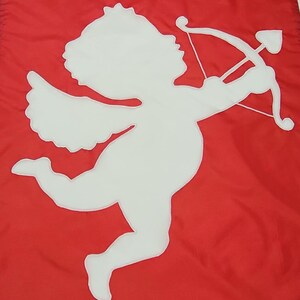May include: A white silhouette of a cupid with wings, holding a bow and arrow, on a red background.