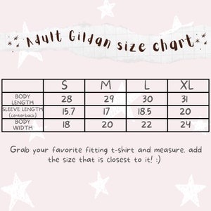 Puede incluir: Una tabla de tallas Gildan para adultos con medidas en pulgadas. La tabla incluye la longitud del cuerpo, la longitud de la manga y el ancho del cuerpo para las tallas S, M, L y XL. El texto en la parte inferior anima a los clientes a medir su camiseta favorita.