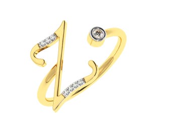Puede incluir: Un anillo de oro con un acento de diamante en forma de la letra Z. El anillo está engastado con pequeños diamantes a lo largo de la banda.