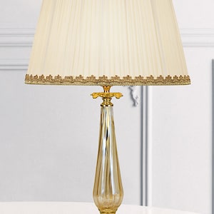 Made in Italy | Bright gold Brass lamp with lion paws and light amber Murano glass, ivory-colored pleated silk lampshade. ITEM C453