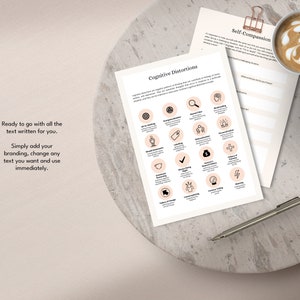 May include: Two printable worksheets with a light pink background. The first worksheet is titled "Cognitive Distortions" and features a grid of 16 icons representing different cognitive distortions. The second worksheet is titled "Self-Compassion" and has a section for journaling.