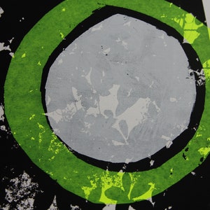 May include: Abstract art print featuring a green circle surrounding a grey circle against a black backdrop.