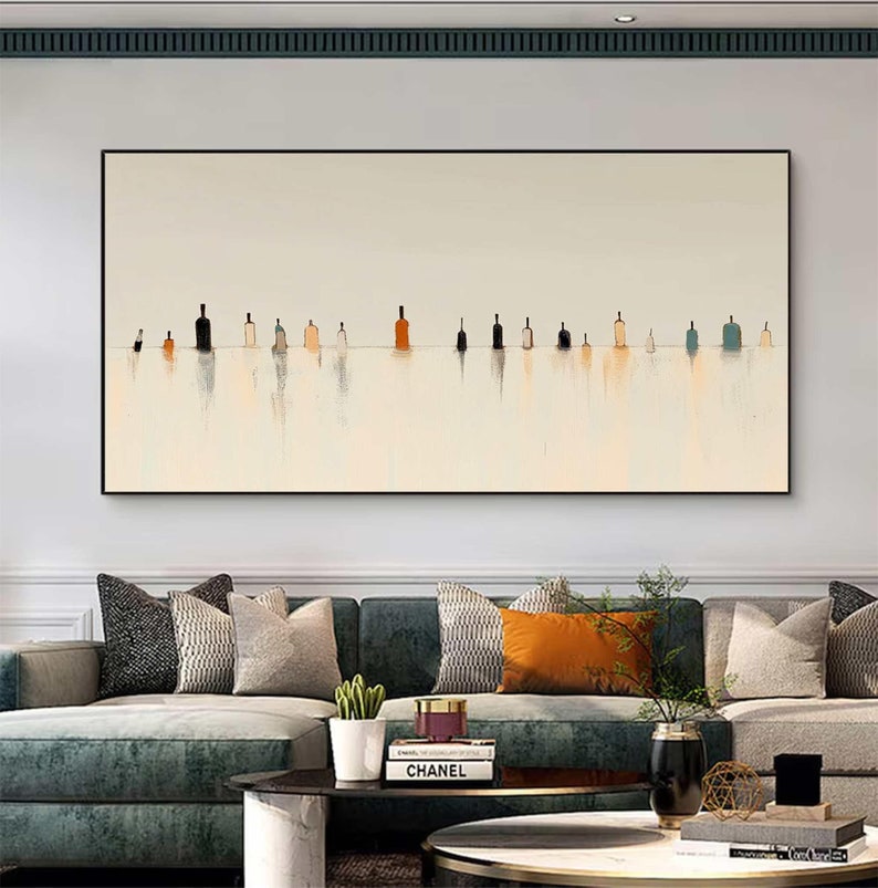 May include: A rectangular wall art piece featuring a horizontal line of various small, stylized bottle shapes in shades of black, brown, blue, and beige. The bottles are set against a light cream background with vertical brushstroke reflections.