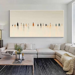 May include: A large horizontal rectangular wall art piece featuring a series of abstract bottle silhouettes in shades of black, orange, and blue, arranged in a single line against a pale cream background with soft vertical reflections below.