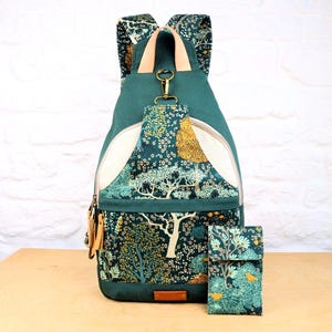 Sewing Pattern for a large backpack with lots of pockets, unisex style can be worn by men or women, converts to a sling bag, with matching phone case pattern, fully lined backpack for laptop, DIY sewing project, contemporary design rucksack to make yourself.