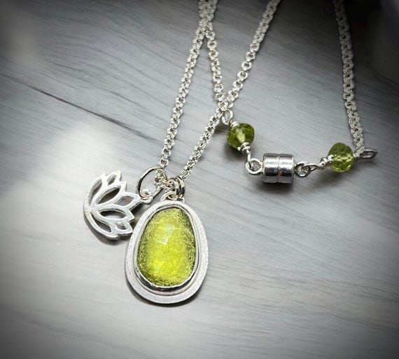 Sterling silver Peridot and Lotus charm necklace.