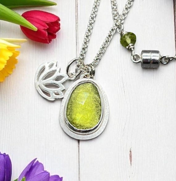 Sterling silver Peridot and Lotus charm necklace.