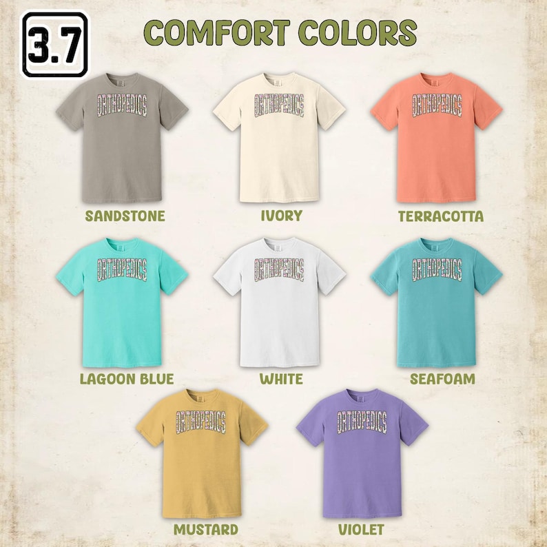 May include: A set of ten t-shirts in various colors, including sandstone, ivory, terracotta, lagoon blue, white, seafoam, mustard, and violet. Each t-shirt features the word "ORTHOPEDICS" printed in a stylized font.