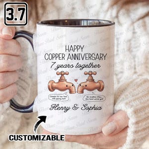 May include: White ceramic mug with a black rim, featuring the text "HAPPY COPPER ANNIVERSARY 7 years together." Includes illustrations of two copper faucets with speech bubbles and the names "Henry & Sophia."