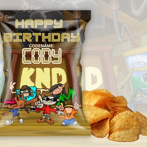 May include: A brown chip bag with a cartoon image of kids from the show KND. The bag says "Happy Birthday" and "Codename: Cody".