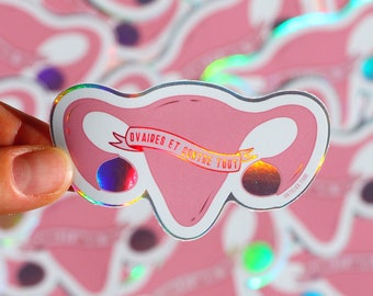 Feminist sticker in an holographic vinyl ovaries with a wordplay on "Against all odds" in french for exterior or customizing objects