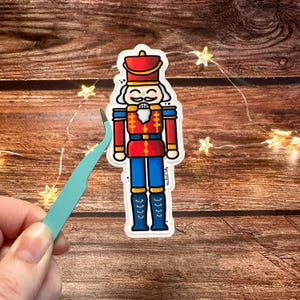 Adesivo quebra-nozes de Natal | Adesivo de inverno de Natal | Adesivo de vinil recortado de Natal | Papelaria festiva, enfeite de adesivo holográfico fofo
