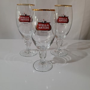 Superbes grands calices Stella Artois Ammo 1336 40 cl. Et un verre à bière artisanale belge de 33 cl. Lot de 3 siens
