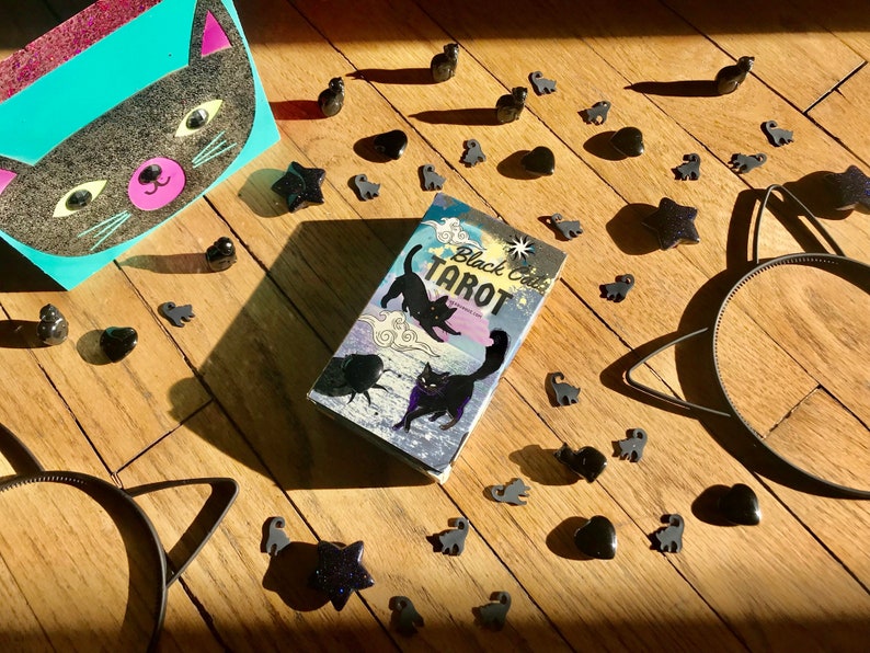 The Black Cat Tarot Deck is a beautifully designed tarot set that features intricate illustrations inspired by the mystique and symbolism of black cats.