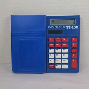 May include: A blue Texas Instruments TI-108 calculator with a matching case. The calculator has red and white buttons, and a small display screen. The case is open, revealing the calculator.
