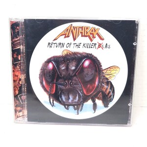 May include: Anthrax "Return of the Killer Bs" CD. The album cover features a detailed illustration of a bee with skull-like eyes and the band's logo. The CD case is clear, with the album title and band name prominently displayed.
