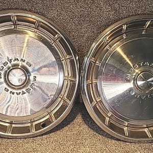 May include: A set of three ceramic mugs with a speckled, matte finish. The mugs are in shades of cream, light gray, and dark gray. Each mug has a simple, minimalist design, perfect for coffee or tea.