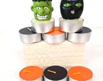 Lote vintage de 8 velas votivas de Halloween com o tema Frankenstein e Gato, nas cores preto e laranja.