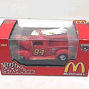May include: A red die-cast McDonald's Racing Champions truck, 3.25 inches in length, in its original packaging. The truck features the number 94 and McDonald's branding. The packaging includes the Racing Champions logo and a 50th Anniversary emblem.