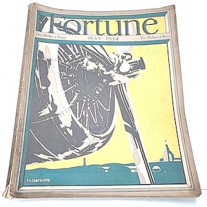 May include: A vintage May 1934 issue of Fortune magazine. The cover features a stylized illustration of machinery in shades of gray and black against a yellow and teal background. The magazine's title is in teal, with the price and date visible.