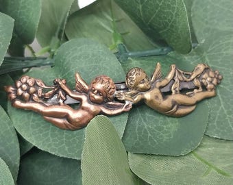 Pinza para el cabello francesa con querubines en tonos bronce y cobre, accesorio para el cabello con forma de ángel alado.