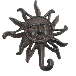 May include: A white ceramic mug with a black handle and the text "But First, Coffee" in a black, handwritten-style font. The mug is on a white surface.