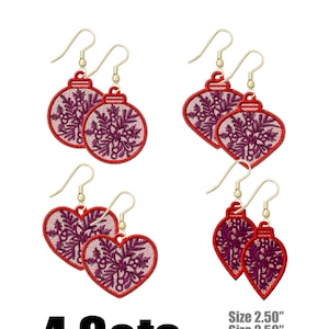 May include: Four sets of red and purple Christmas ornament earrings with gold hooks. Each set includes two earrings, one with a round ornament shape and one with a heart shape. The ornaments are decorated with a snowflake design. The earrings are 2.5 inches in size.