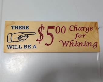 Wooden sign "There will be a 5 dollar Charge for Whining"