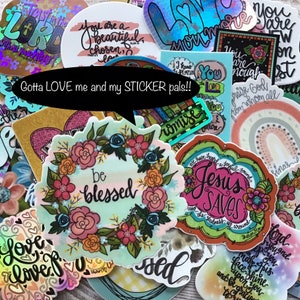 May include: A collection of colorful stickers with religious and inspirational messages. The stickers feature floral wreaths, rainbows, and handwritten text. Some of the messages include "Be Blessed", "Jesus Saves", "You are enough", and "Gotta LOVE me and my STICKER pals!!"