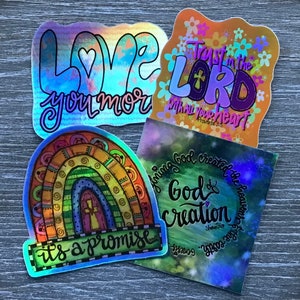 May include: Four iridescent stickers with religious themes. The first sticker is a rainbow with the text "it's a promise". The second sticker has a heart with the text "Love you more". The third sticker has a heart with the text "Trust in the Lord with all your heart" and the scripture reference "Proverbs 3:5". The fourth sticker has a galaxy background with the text "Honing God creator of the heavens and the earth" and "God & Creation".